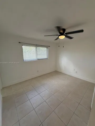 a white toilet sitting next to a bath tub