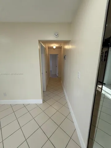 a white toilet sitting next to a bath tub