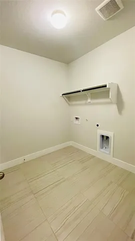 a living room with furniture a table and chairs