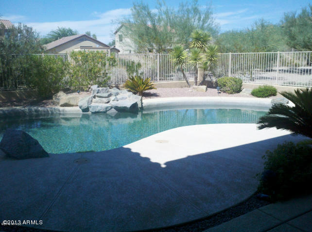 17492 West Rock Ledge Road Goodyear, AZ 85338 - Photo 3 of 24 pool waterfall