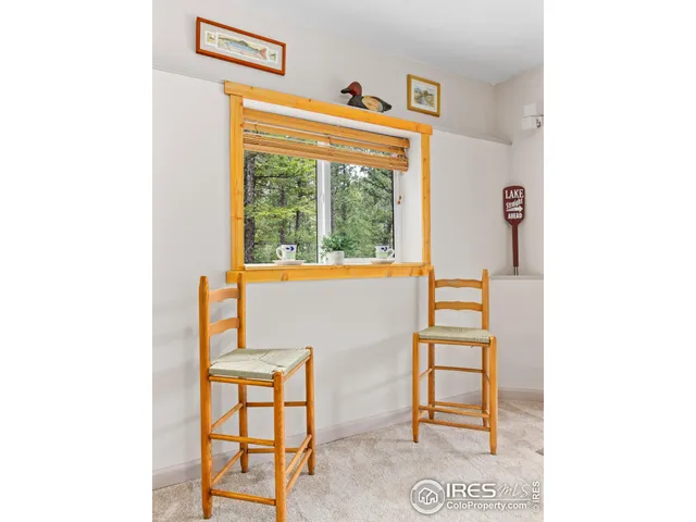 a view of a room with furniture and window