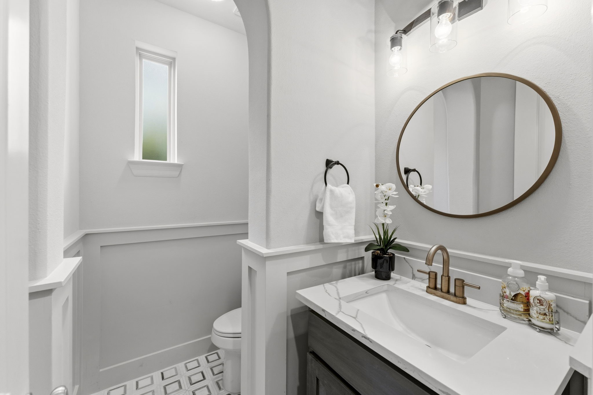 10 Spincaster Drive Spring, TX 77389 - Photo 9 of 38 Designer powder bath featuring custom wainscoting, upgraded fixtures and elevated finishes