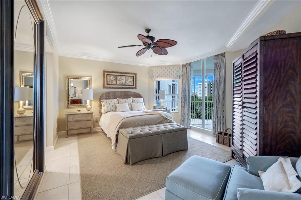 315 Dunes Boulevard, Unit 307 Naples, FL 34110 - Photo 17 of 44 a bedroom with a bed couch and window