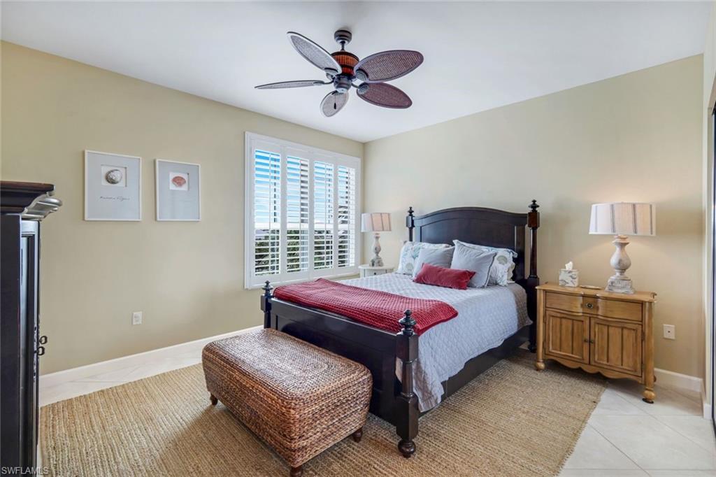 315 Dunes Boulevard, Unit 307 Naples, FL 34110 - Photo 24 of 44 a bedroom with a bed and window