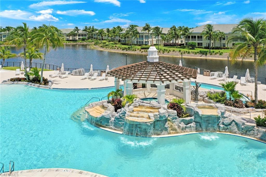 315 Dunes Boulevard, Unit 307 Naples, FL 34110 - Photo 34 of 44 a view of a lake with a mountain view