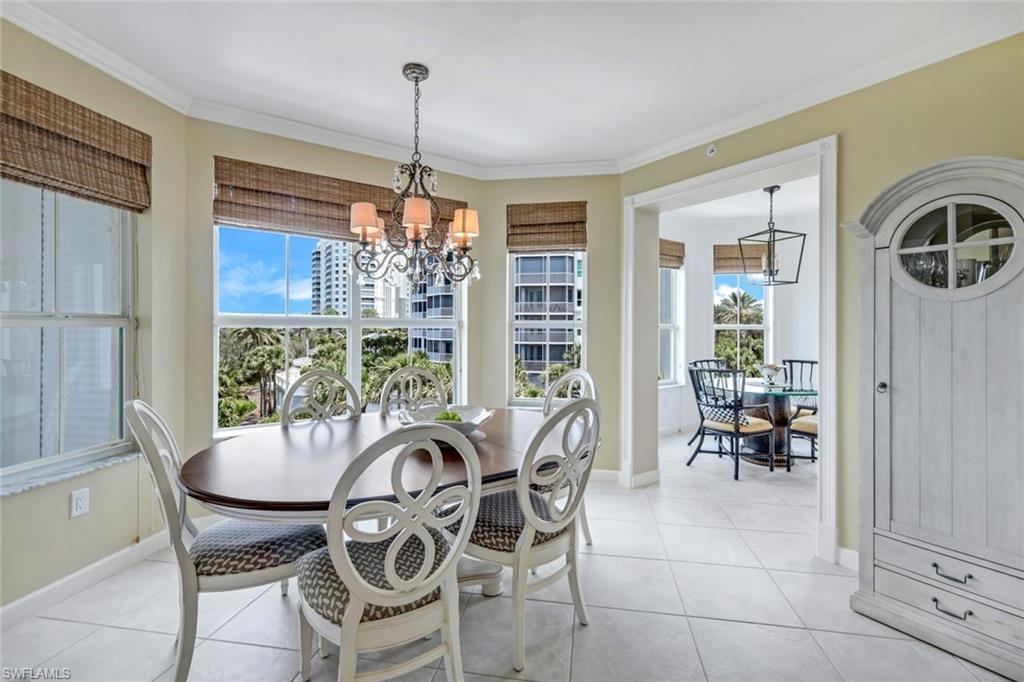 315 Dunes Boulevard, Unit 307 Naples, FL 34110 - Photo 10 of 44 a view of a dining room with furniture window and outside view