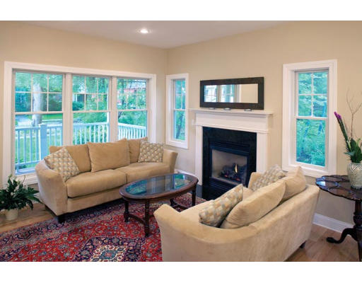 100 Walnut Hill Road Newton, MA 02461 - Photo 2 of 5 a living room with furniture a fireplace and a large window