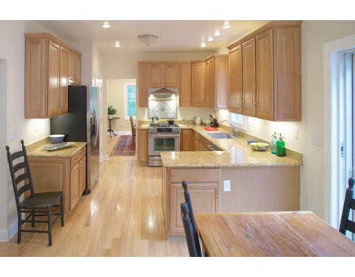 100 Walnut Hill Road Newton, MA 02461 - Photo 4 of 5 a living room with stainless steel appliances kitchen island granite countertop furniture and a view of kitchen