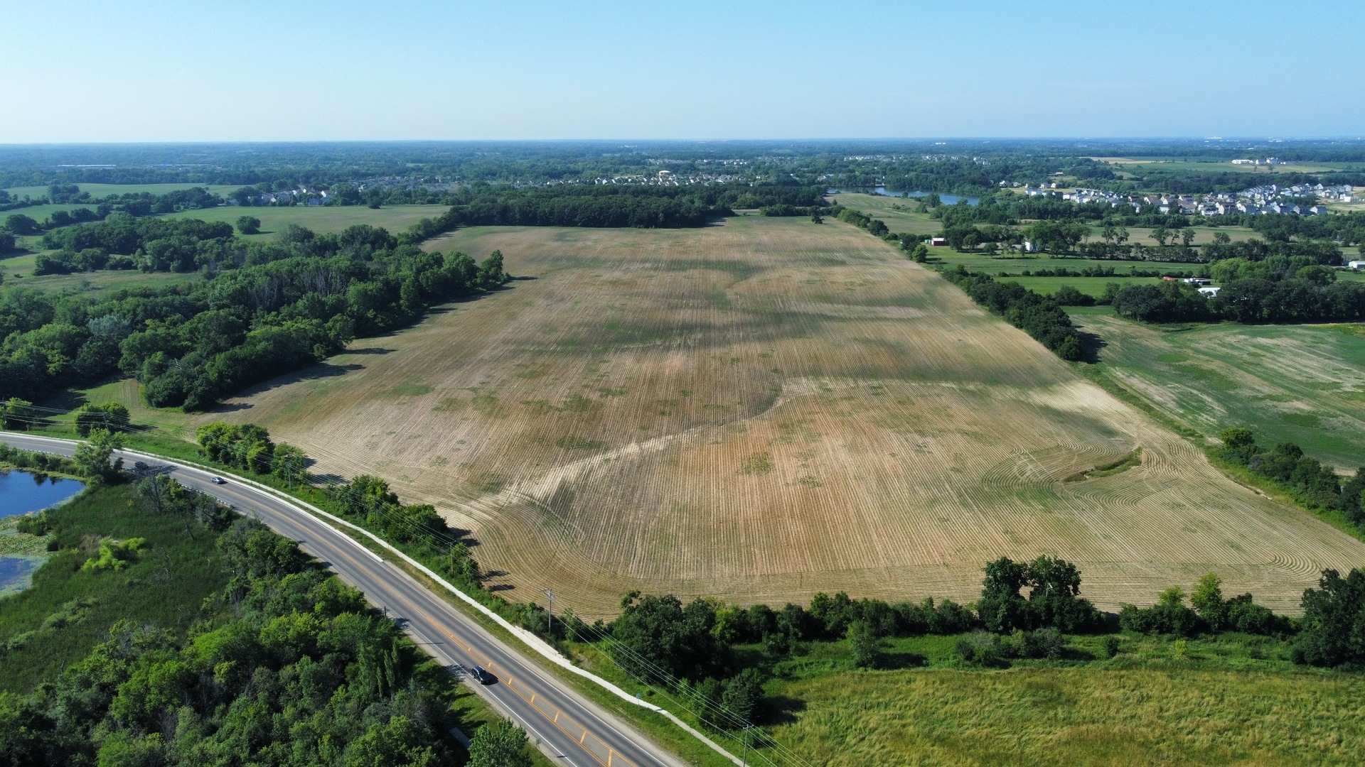 21210 West Grass Lake Road Lake Villa, IL 60046 - Photo 11 of 14 an aerial view of residential houses with outdoor space and trees