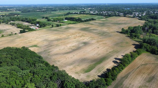 an aerial view of a houses with a yard