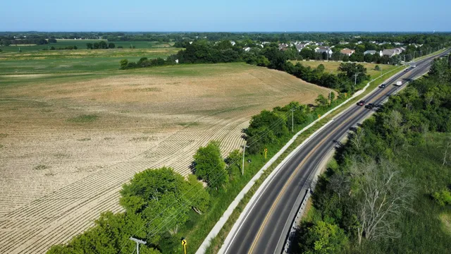 a view of a field with an ocean