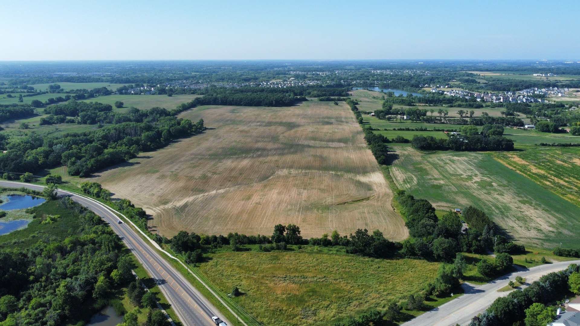 21210 West Grass Lake Road Lake Villa, IL 60046 - Photo 10 of 14 an aerial view of residential houses with outdoor space and trees