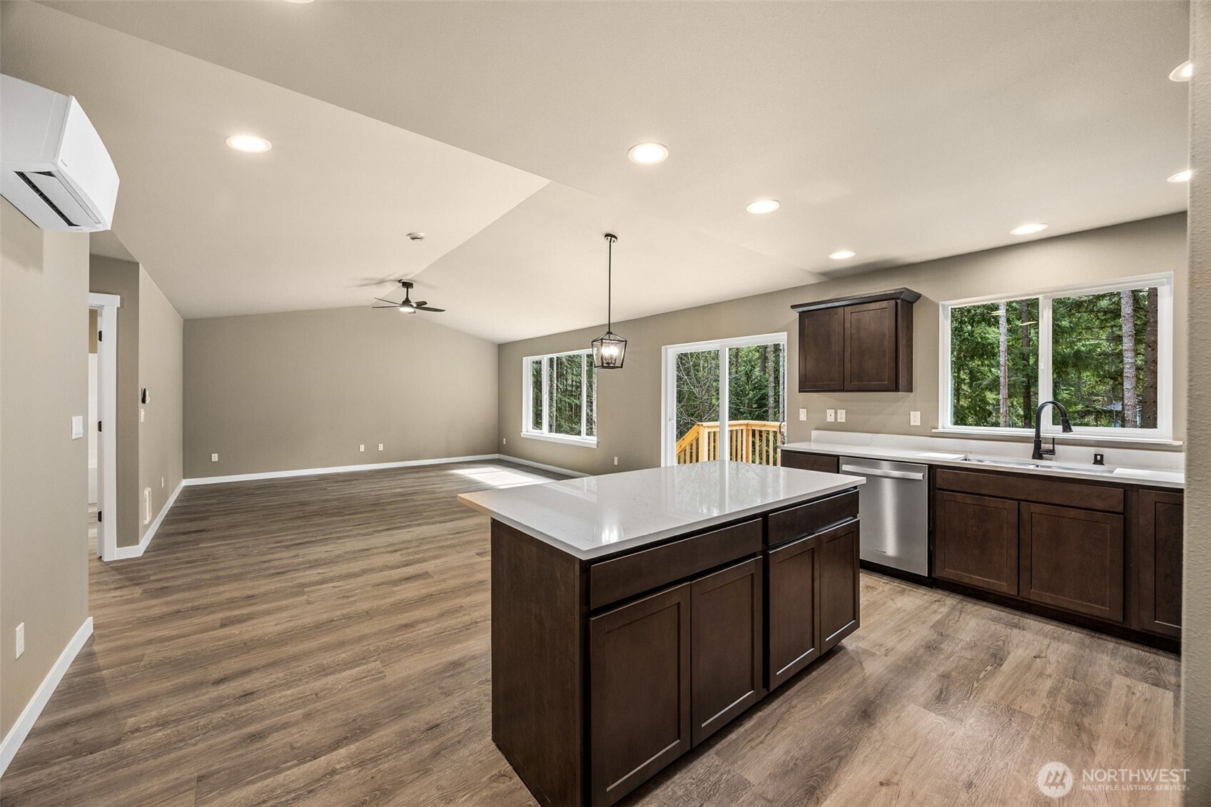 18410 Rampart Drive Southeast Yelm, WA 98597 - Photo 11 of 30 a kitchen with a stove sink and a microwave oven