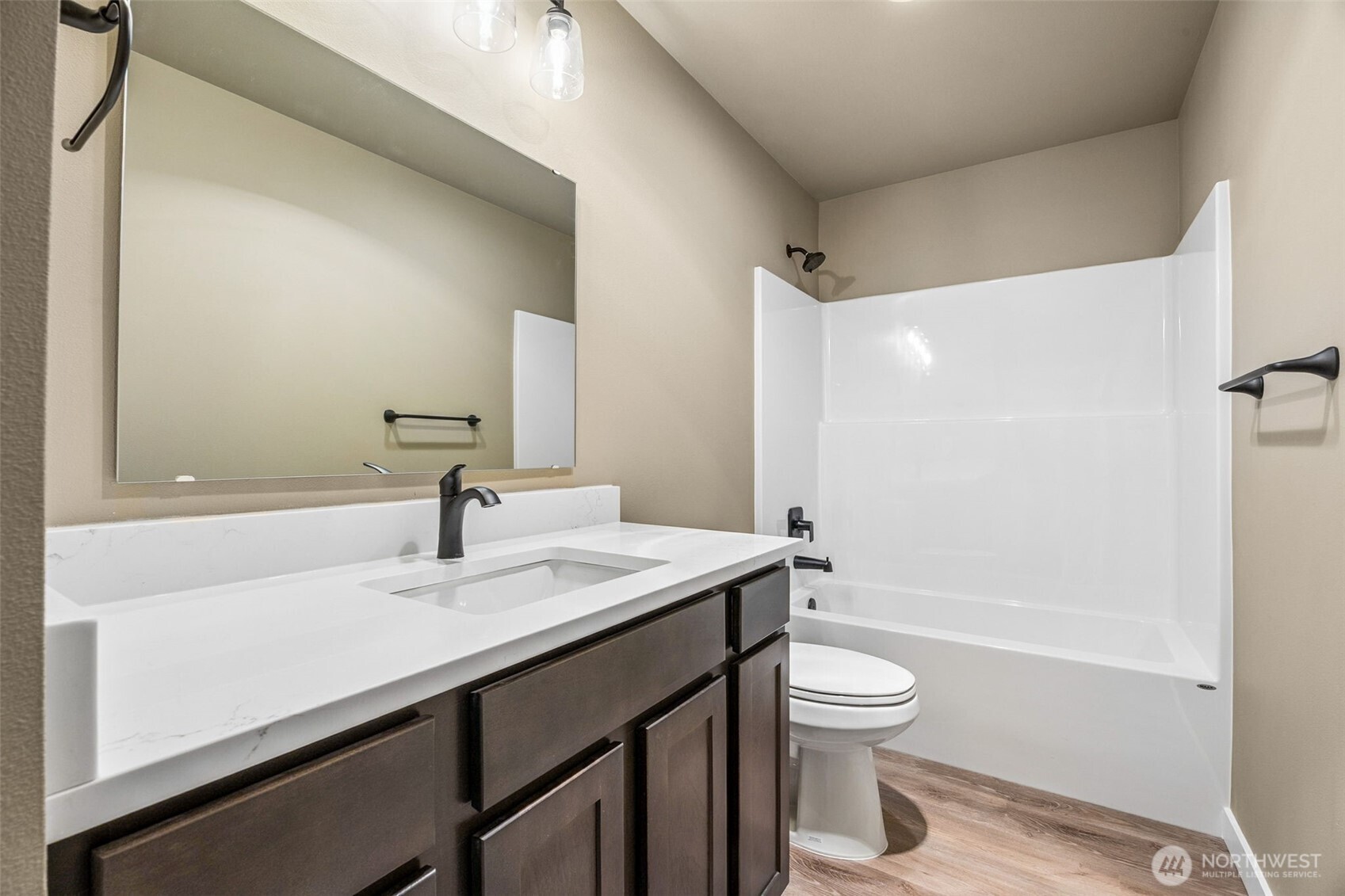 18410 Rampart Drive Southeast Yelm, WA 98597 - Photo 13 of 30 a bathroom with a sink a toilet and shower