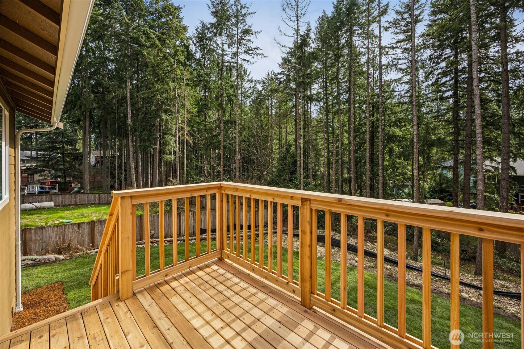 18410 Rampart Drive Southeast Yelm, WA 98597 - Photo 20 of 30 a view of balcony with wooden floor and fence
