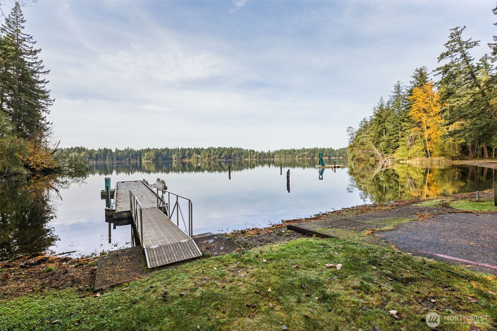 18410 Rampart Drive Southeast Yelm, WA 98597 - Photo 23 of 30 a view of a lake with a yard