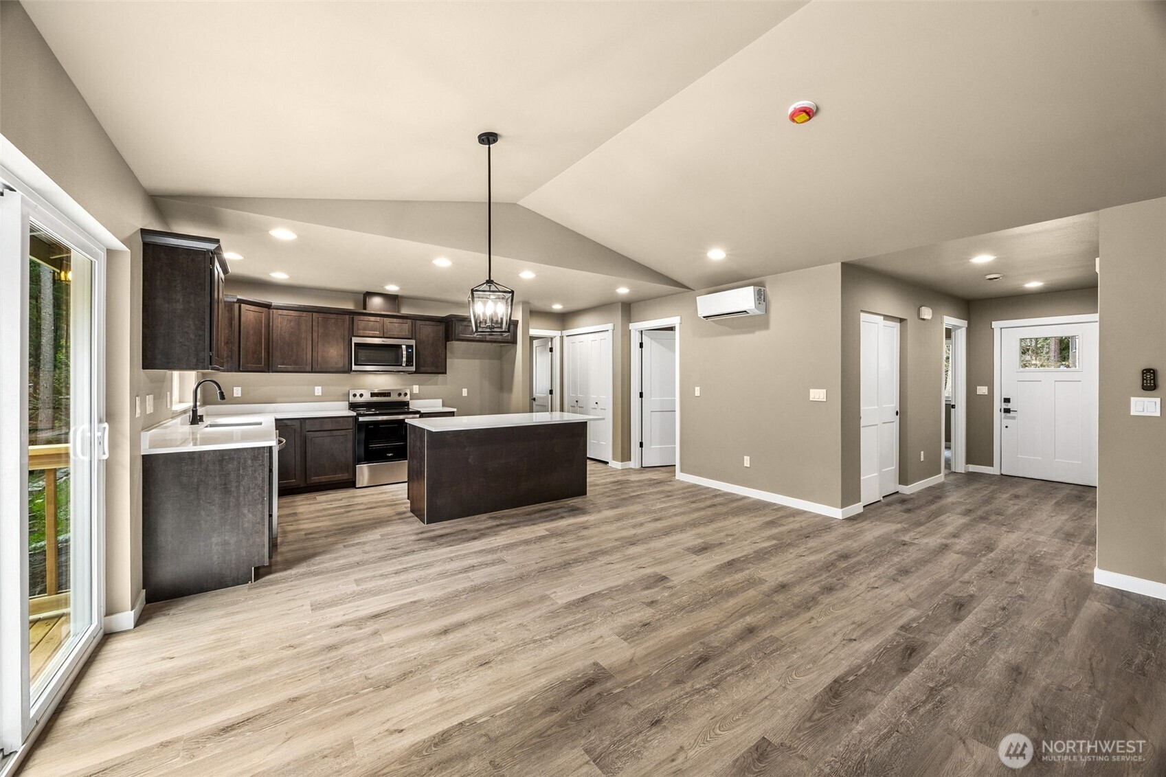 18410 Rampart Drive Southeast Yelm, WA 98597 - Photo 6 of 30 a view of kitchen with stainless steel appliances kitchen island a sink stove and refrigerator