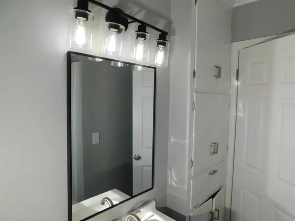 a bathroom with a glass shower door