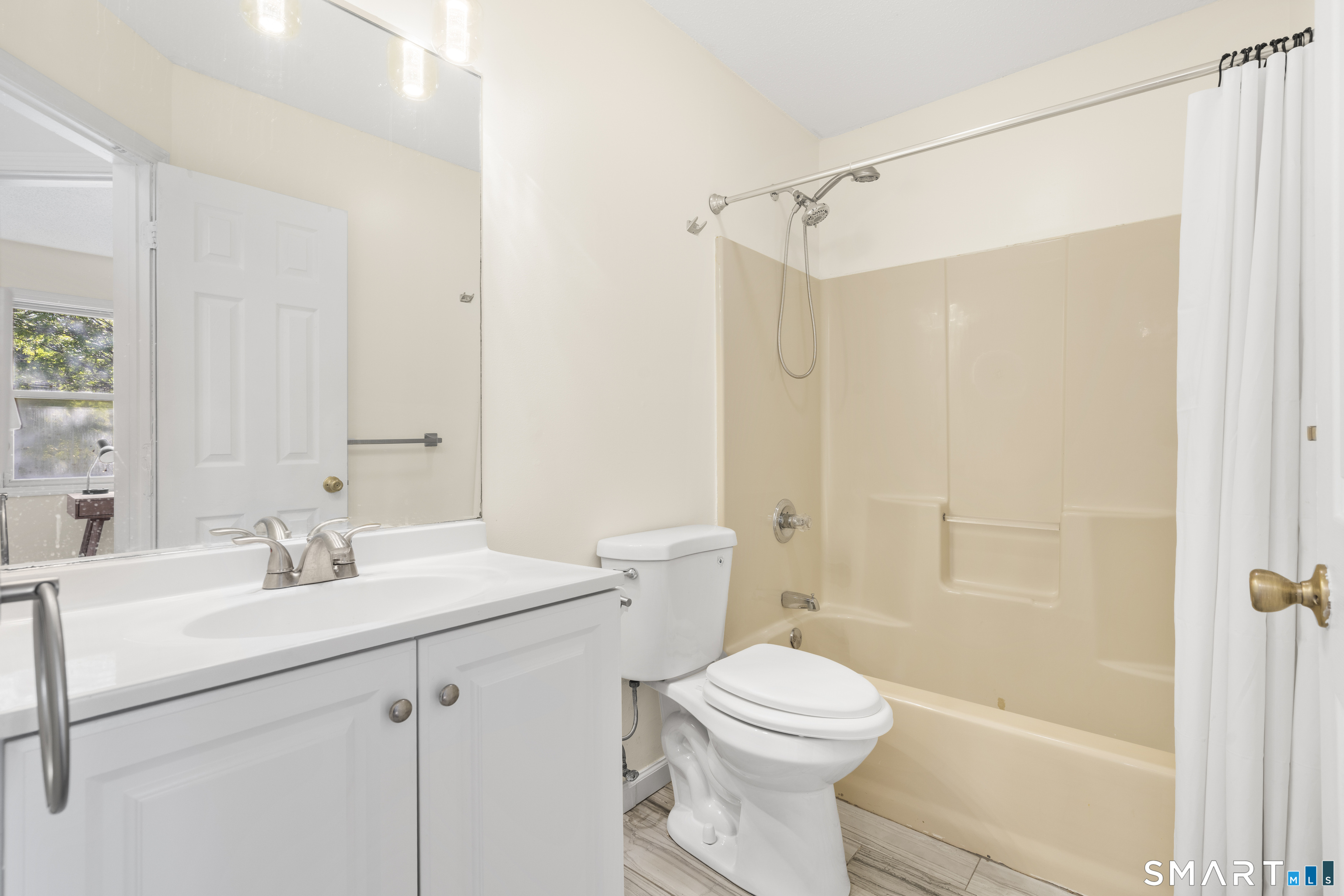 39 Joseph Lane Hamden, CT 06514 - Photo 27 of 40 a bathroom with a sink a toilet and shower