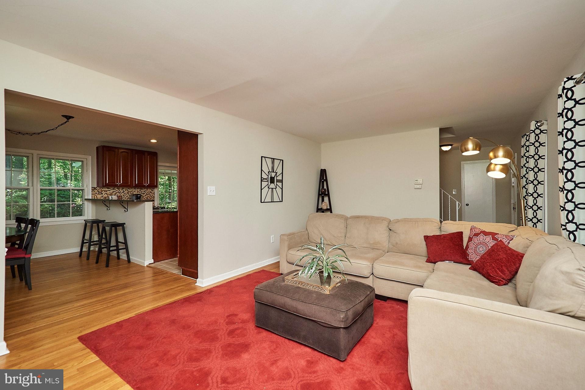 2421 Silver Fox Lane Reston, VA 20191 - Photo 8 of 27 a living room with furniture and a wooden floor