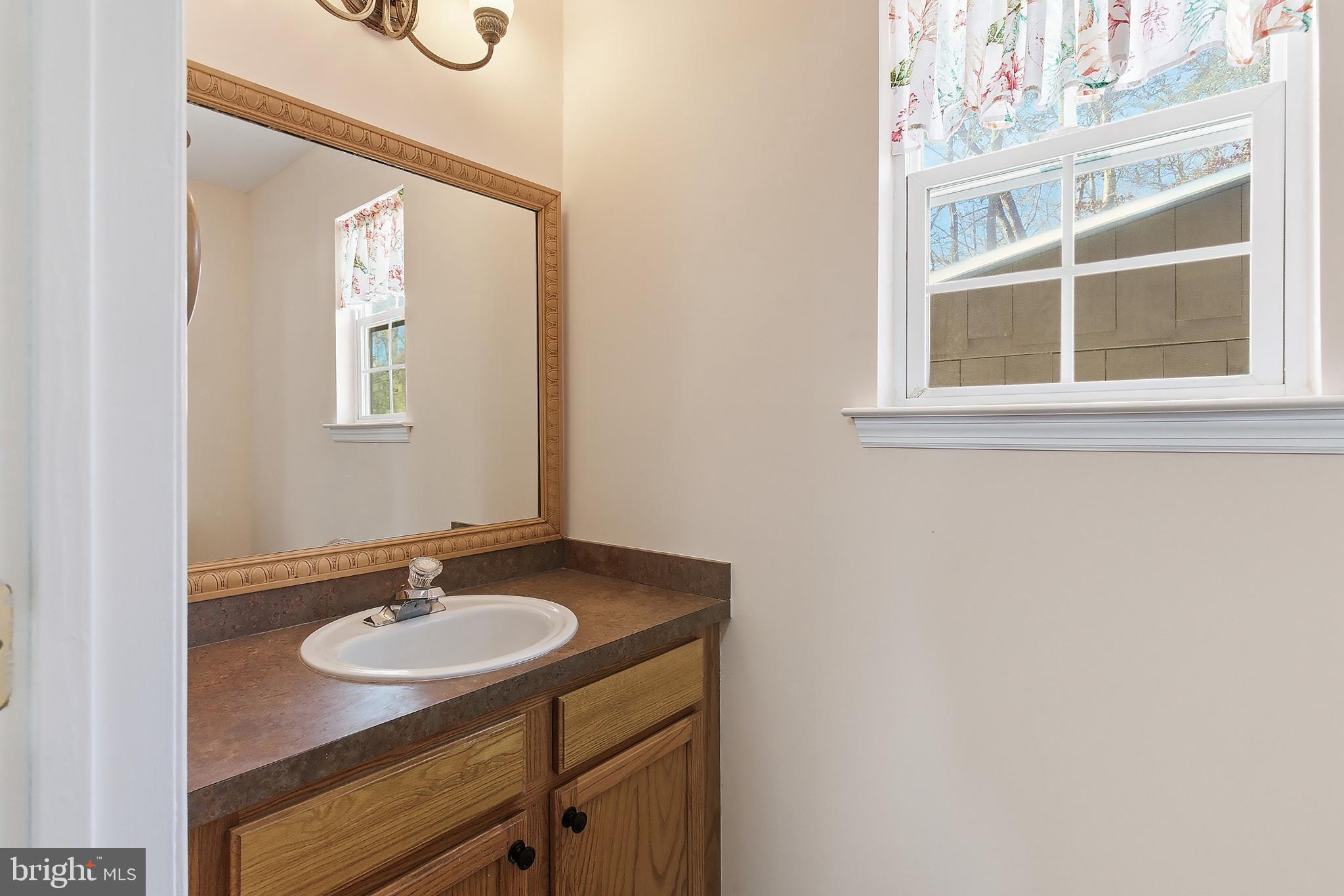 31 Hillcrest Lane Tuckerton, NJ 08087 - Photo 11 of 33 a bathroom with a sink and a mirror
