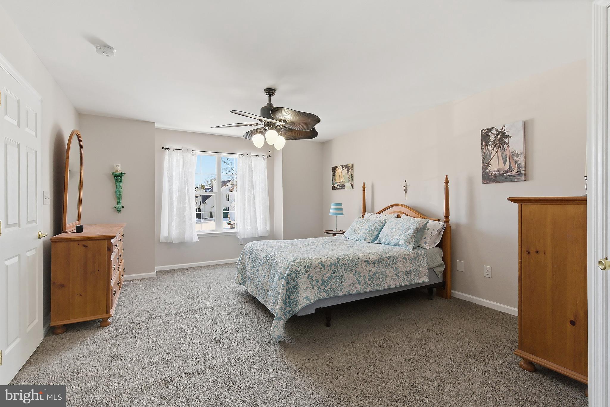 31 Hillcrest Lane Tuckerton, NJ 08087 - Photo 14 of 33 a bedroom with a bed and a chandelier