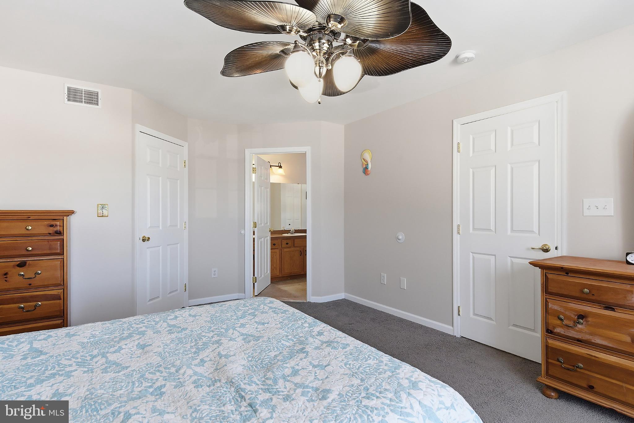 31 Hillcrest Lane Tuckerton, NJ 08087 - Photo 15 of 33 a bedroom with a bed and a chandelier