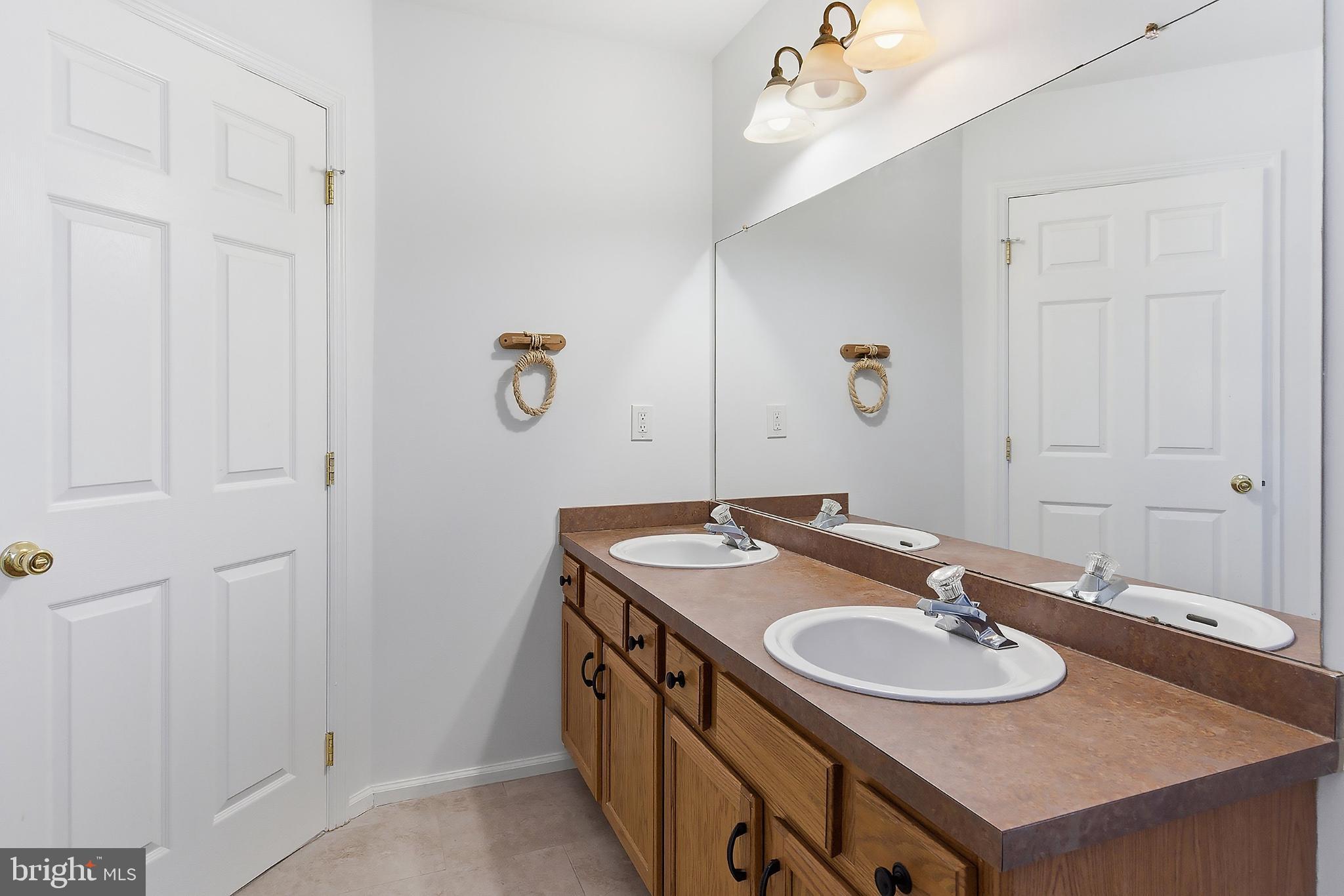 31 Hillcrest Lane Tuckerton, NJ 08087 - Photo 16 of 33 a bathroom with a sink and a mirror