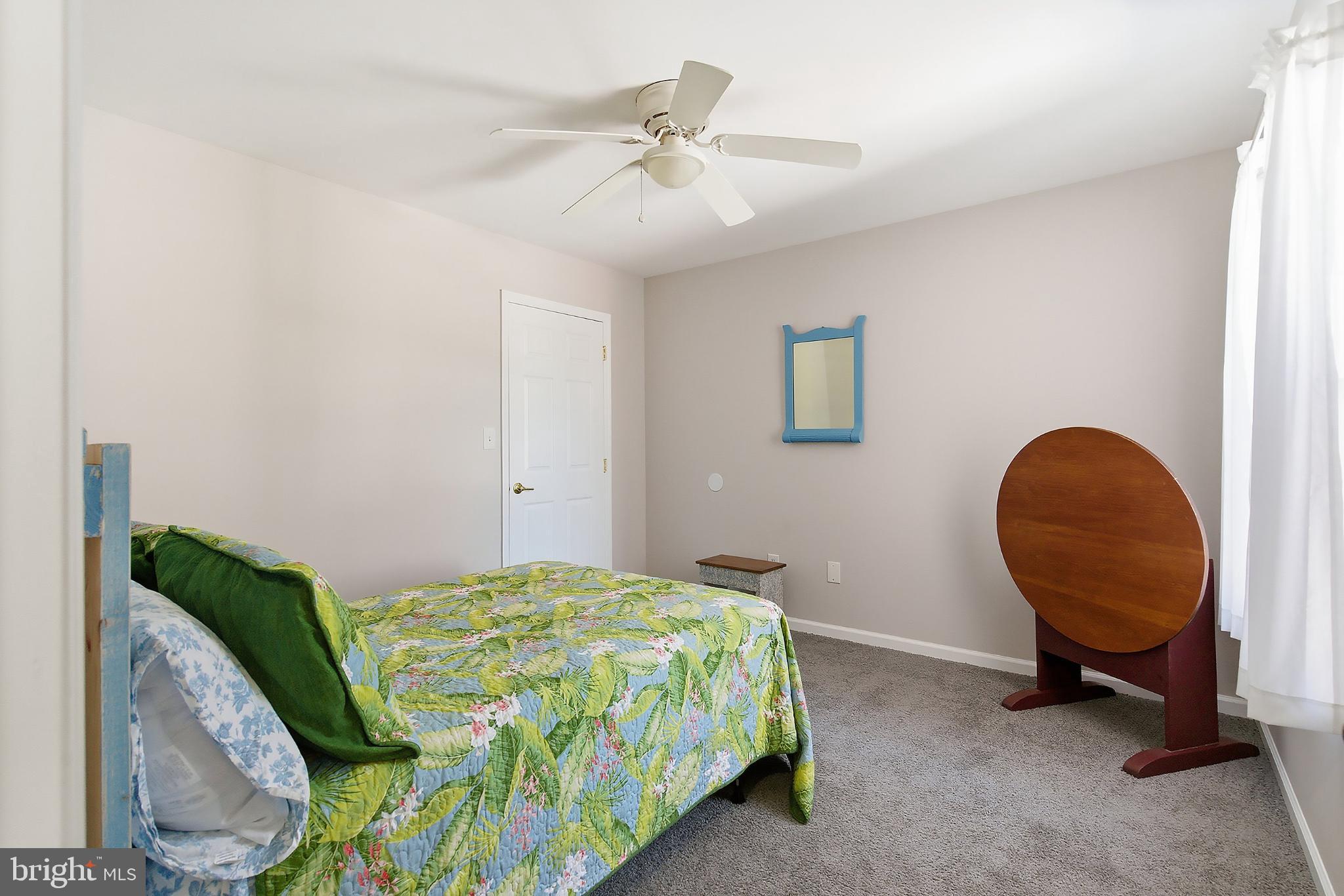 31 Hillcrest Lane Tuckerton, NJ 08087 - Photo 20 of 33 a bedroom with bed and a chandelier