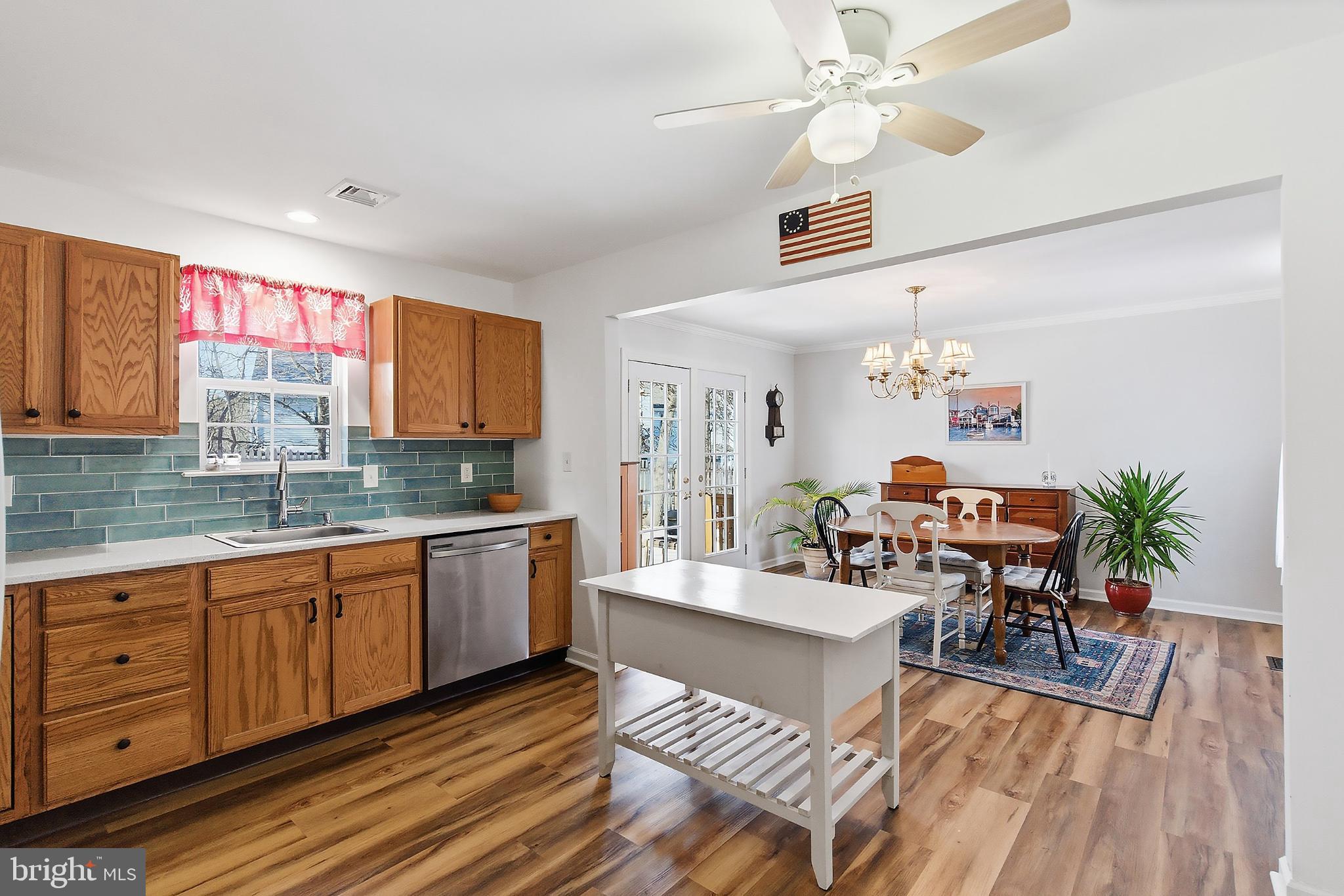 31 Hillcrest Lane Tuckerton, NJ 08087 - Photo 8 of 33 a view of a kitchen counter space a sink wooden floor and a window