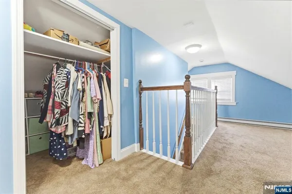 a view of a hallway with closet