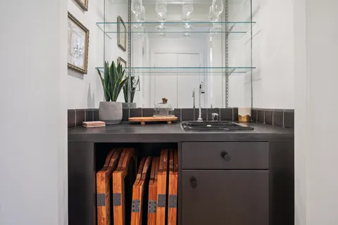 a bedroom with bed and a chandelier