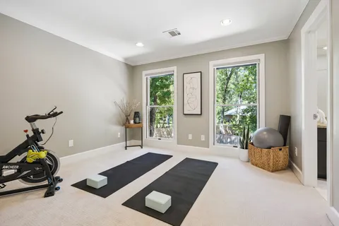 a en suite bathroom with a granite countertop sink and a mirror