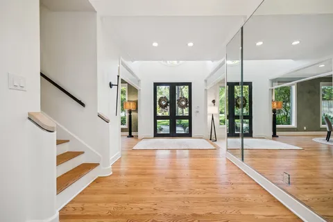 a view of an entryway with wooden floor