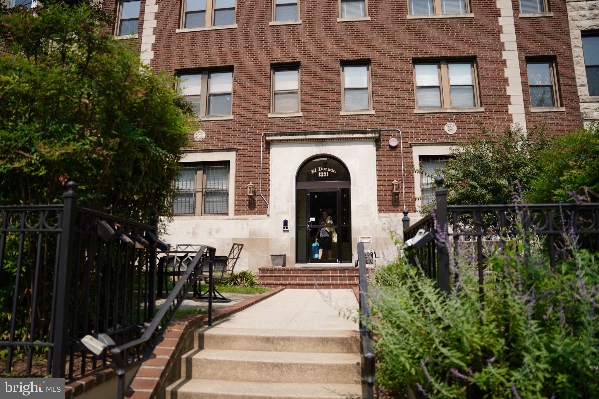 1321 Fairmont Street Northwest, Unit 3 Washington, DC 20009 - Photo 1 of 13 a front view of a house with a garden