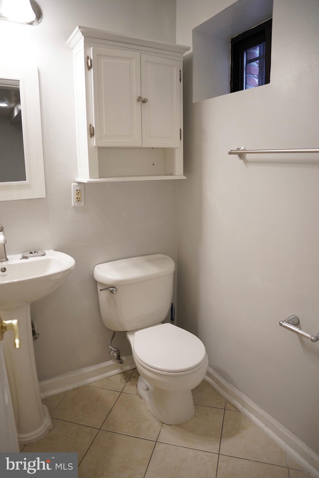 1321 Fairmont Street Northwest, Unit 3 Washington, DC 20009 - Photo 7 of 13 a white toilet sitting next to a bathroom sink