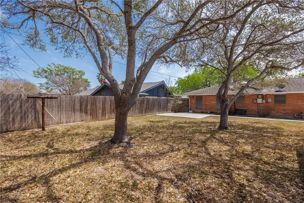 a backyard of a house with lots of green space