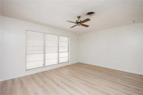 a view of empty room with windows