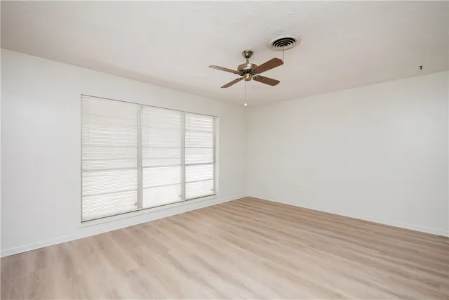 a view of empty room with windows