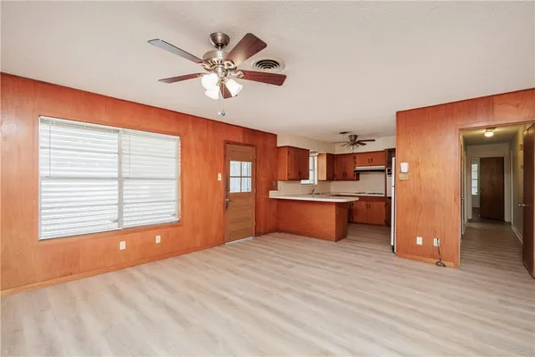 a bedroom with a bed and cabinets