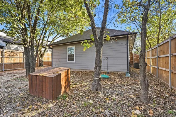 front view of a house with a tree