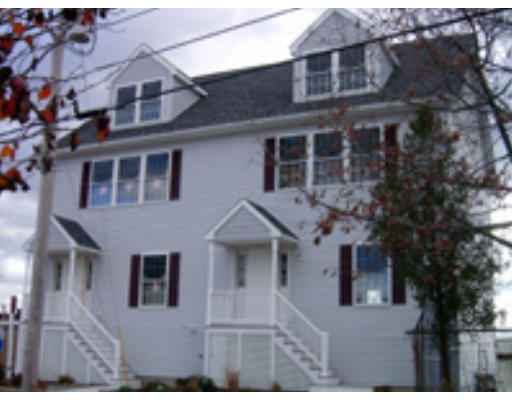 99 Myrtle Street, Unit 99 Medford, MA 02155 - Photo 1 of 1 a front view of a house with windows