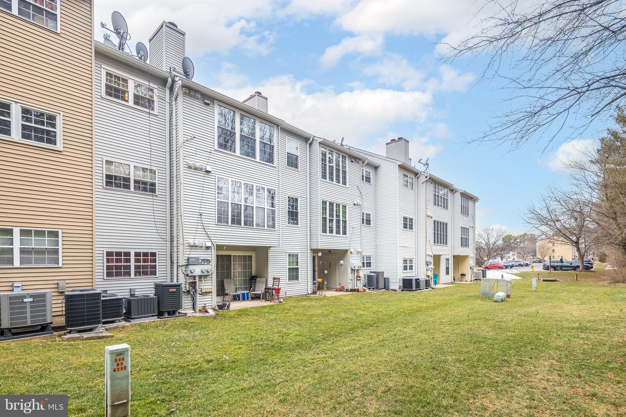 9210 Caspian Way, Unit 302 Manassas, VA 20110 - Photo 23 of 40 a view of building with yard in front of it