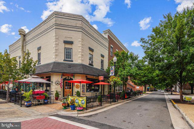 9210 Caspian Way, Unit 302 Manassas, VA 20110 - Photo 34 of 40 a street view with retail shops