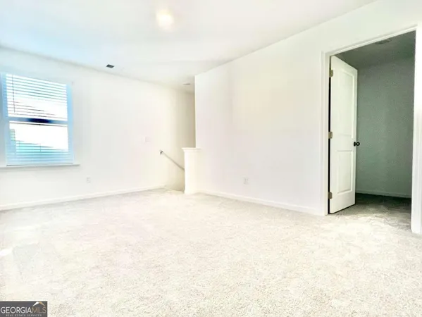 an empty room with a natural light