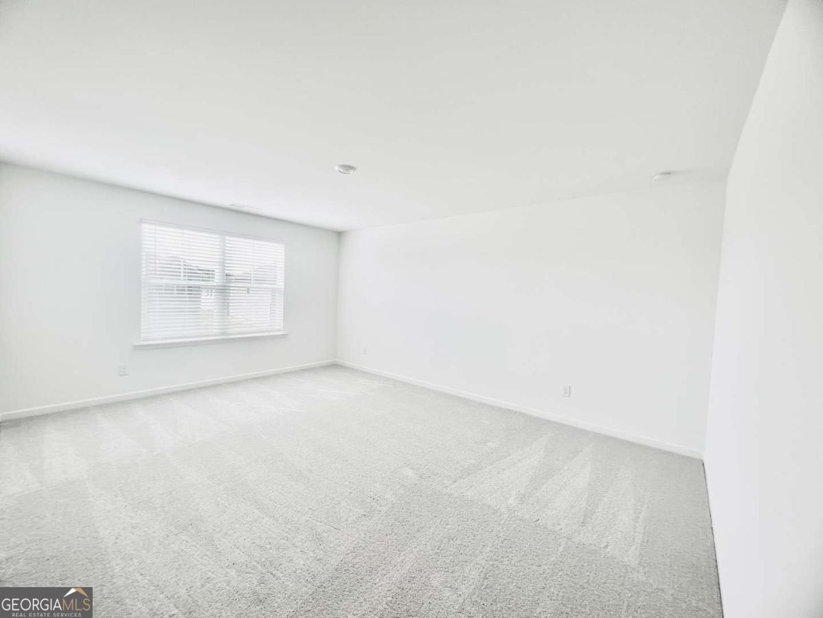 1529 Haypatch Lane Loganville, GA 30052 - Photo 12 of 24 an empty room with a window