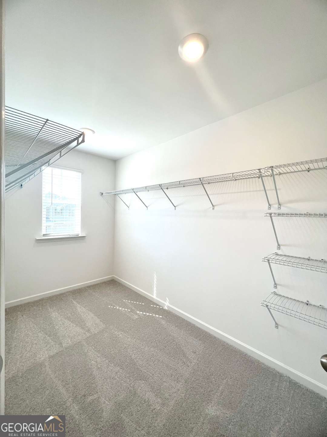 1529 Haypatch Lane Loganville, GA 30052 - Photo 15 of 24 a view of a room with racks on the wall