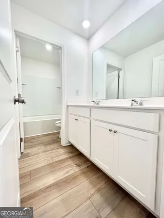 a bathroom with a sink and a toilet