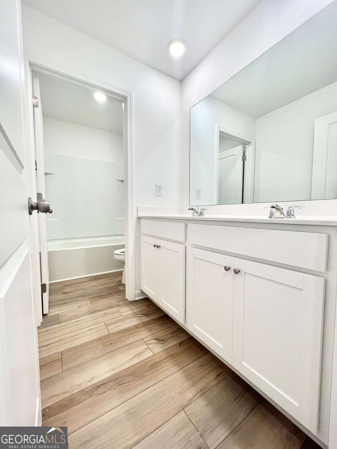 1529 Haypatch Lane Loganville, GA 30052 - Photo 19 of 24 a bathroom with a sink and a mirror