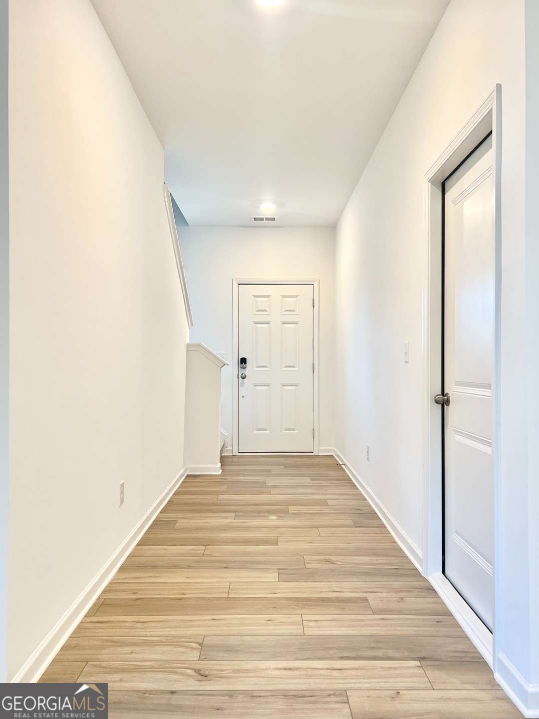 1529 Haypatch Lane Loganville, GA 30052 - Photo 2 of 24 a view of empty room with wooden floor